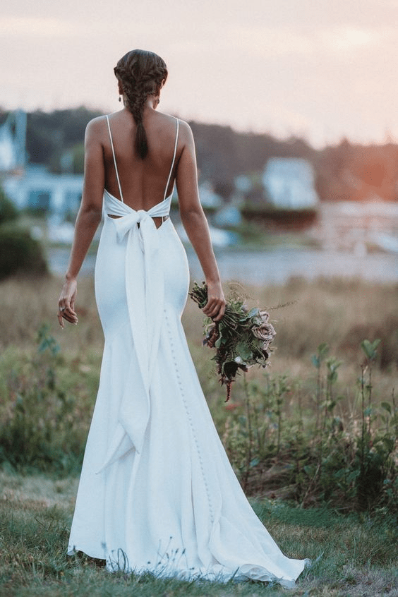 Allure Bridals cross-back wedding dress with a bow 