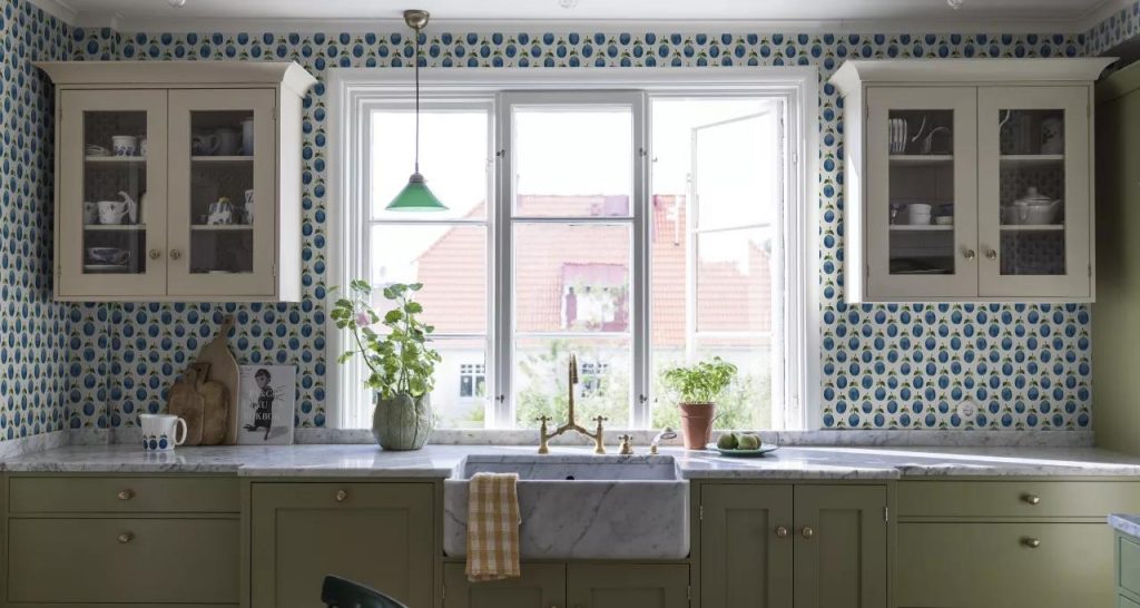 Colored ceramic backsplash tile around window idea