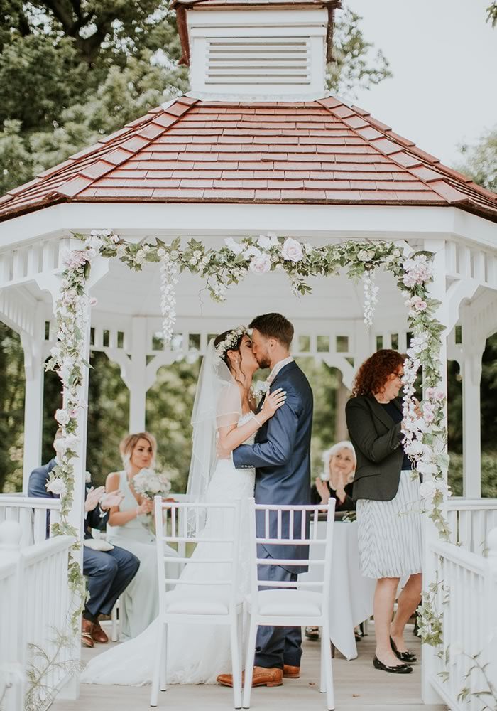 Wedding gazebo decorated with table and chairs