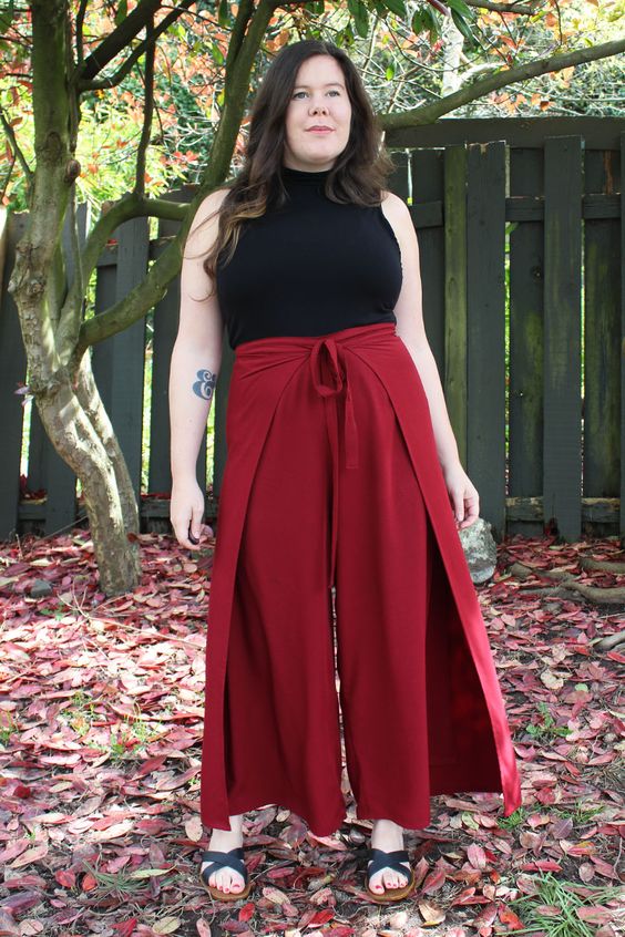 Red skirt pants black top outfit
