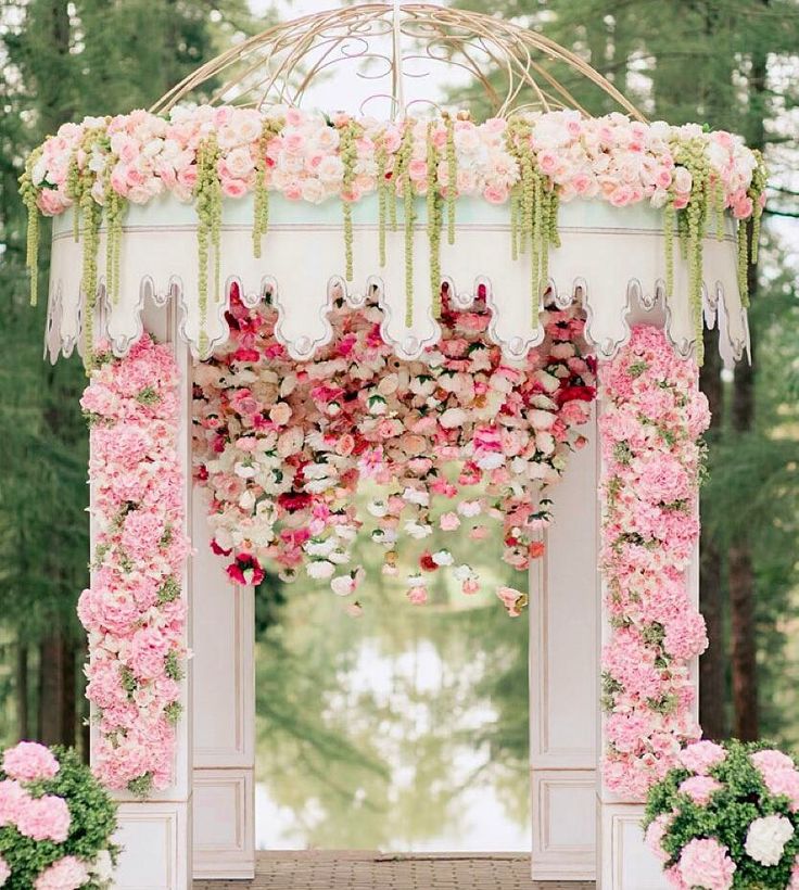 Wedding gazebo with flowers cascading down the ceiling