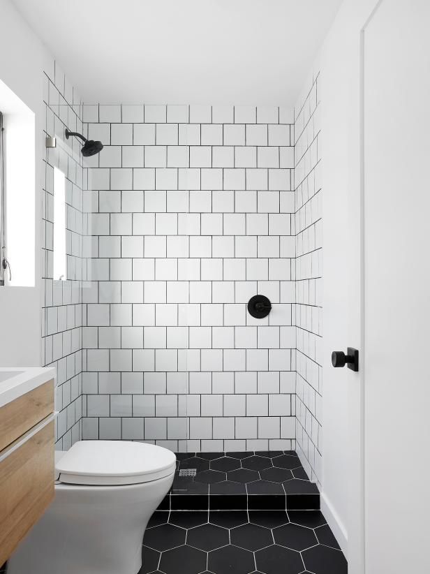 Bathroom design white subway tiles black grout black floor