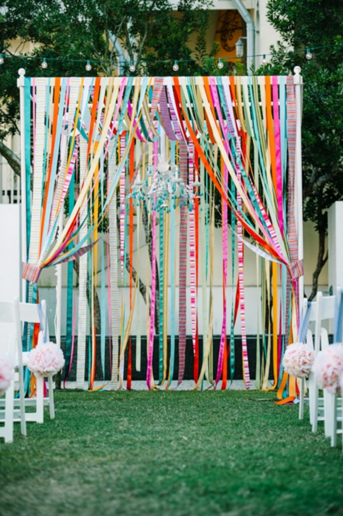 Wedding gazebo decorated with colorful ribbons