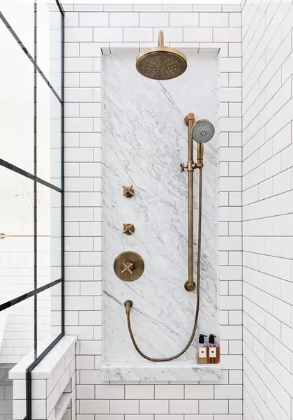 Bathroom design white subway tiles black grout marble shelf