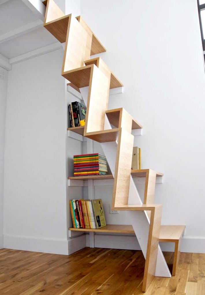 Stairs as bookcase storage idea for loft apartment