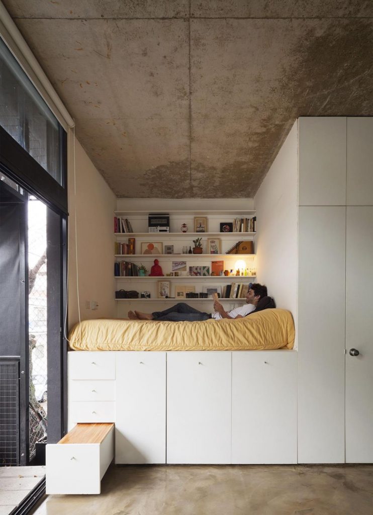 Loft apartment bed as a storage idea