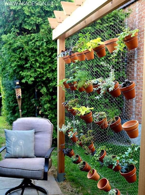Wire wall with hanging mini buckets deck decorating ideas