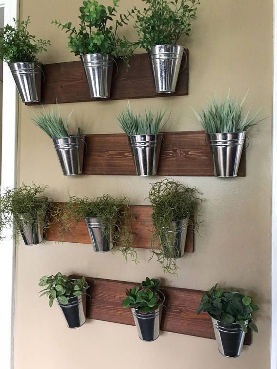 Hanging wooden frames with galvanized planters deck decorating ideas