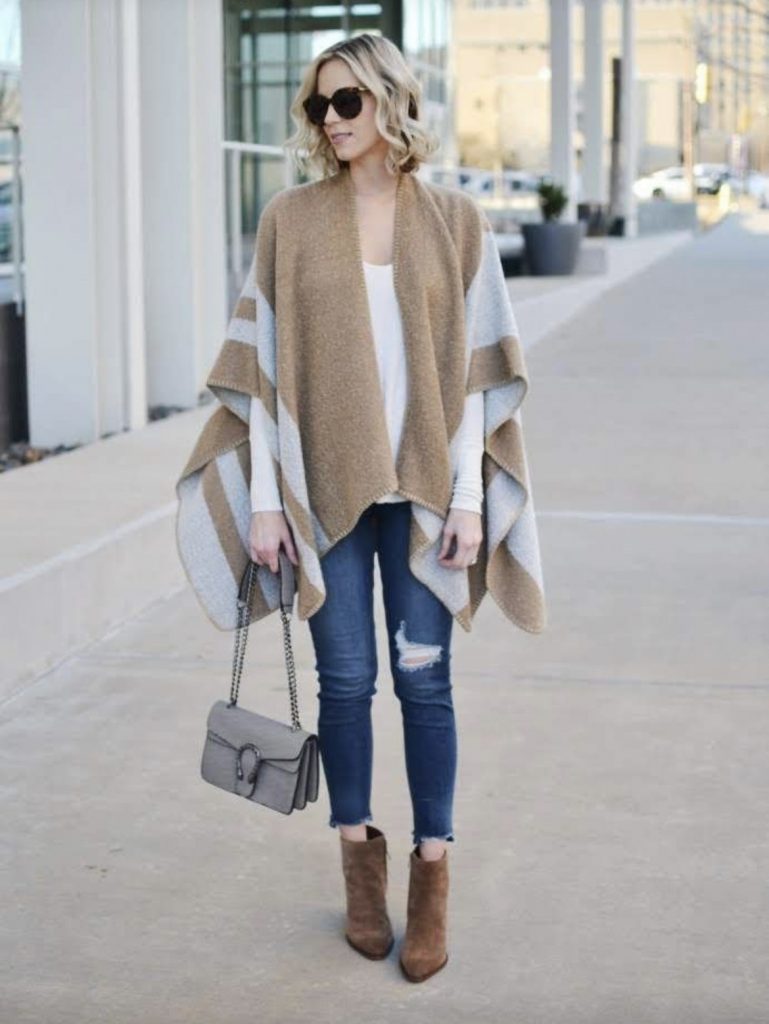 Oversized poncho skinny distressed jeans ankle boots
