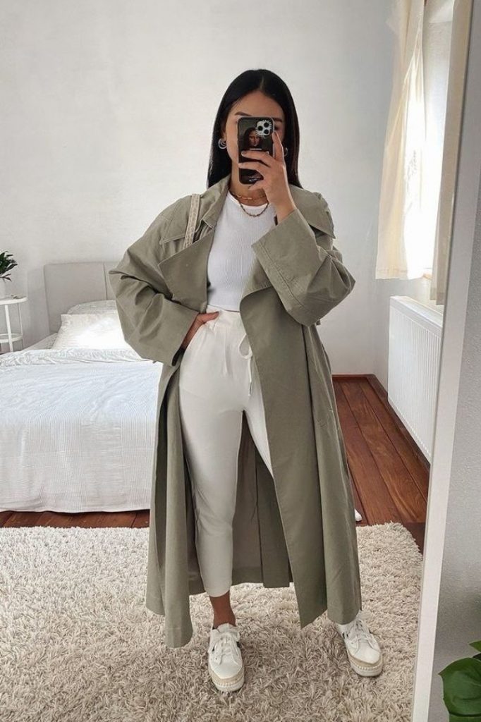 White sports pants white T-shirt olive-green trench coat baddie winter outfit idea