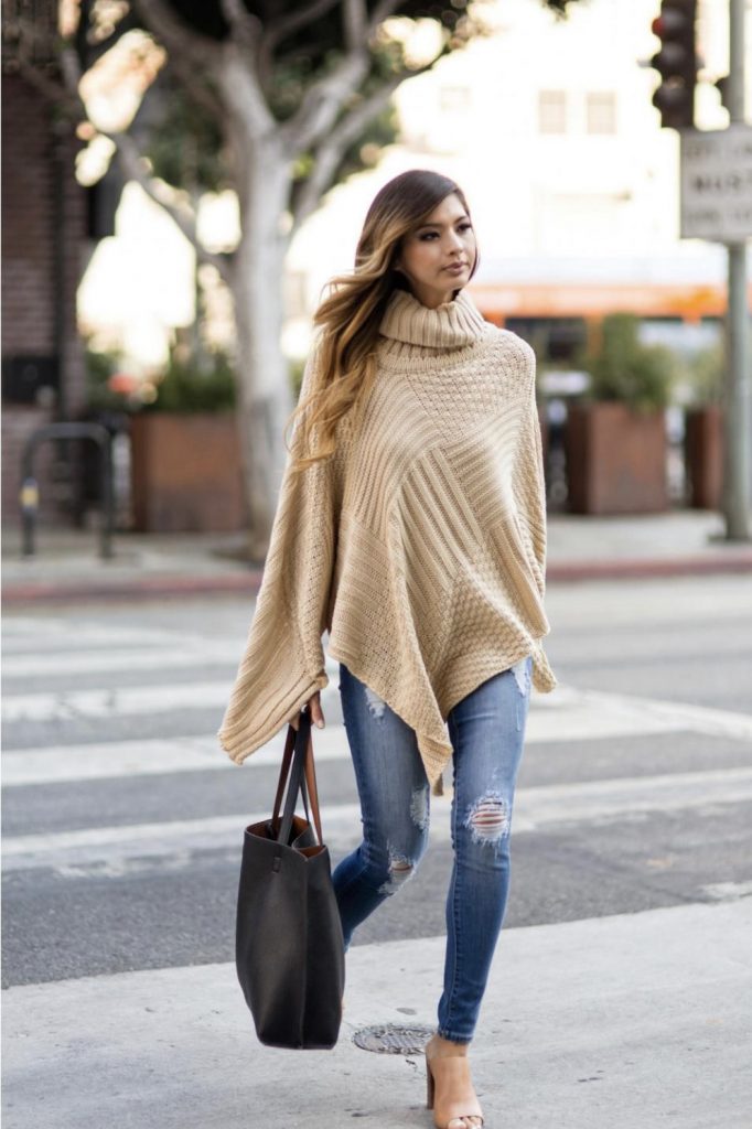Beige oversized turtleneck poncho skinny distressed jeans outfit idea