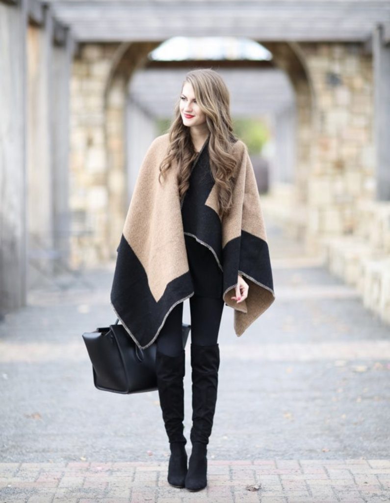 Two-toned poncho black leggings over-the-knee boots outfit idea
