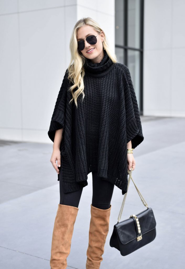 Black sleeved poncho black leggings brown suade over-the-knee boots outfit idea