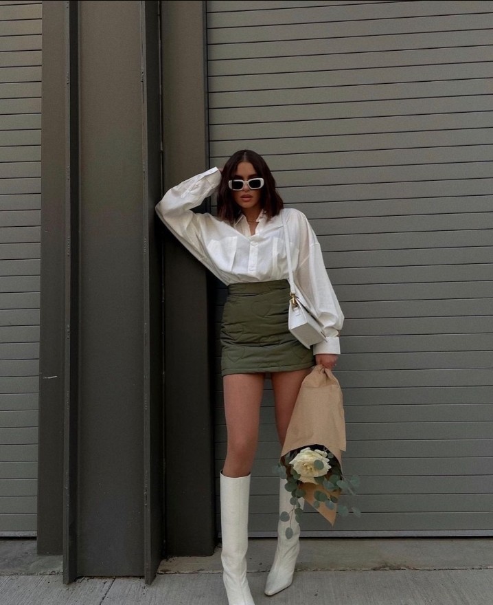 Olive-green high-waisted skirt silk shirt white knee-high boots baddie winter outfit idea for Christmas