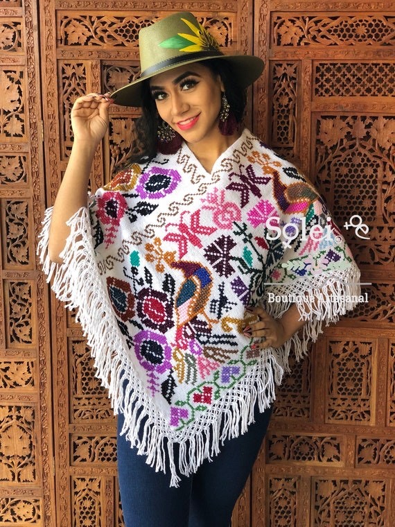Poncho with tassels and traditional patterns example Etsy