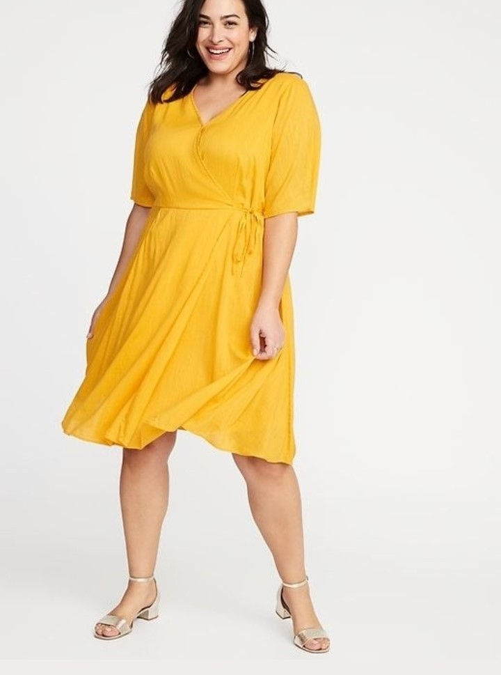 Yellow wrap dress with a defined waist for plus-size apple-shaped body