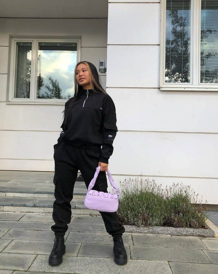 Combat boots black tracksuit pink purse baddie winter outfit idea